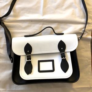 Satchel Handbag in white with black trim.